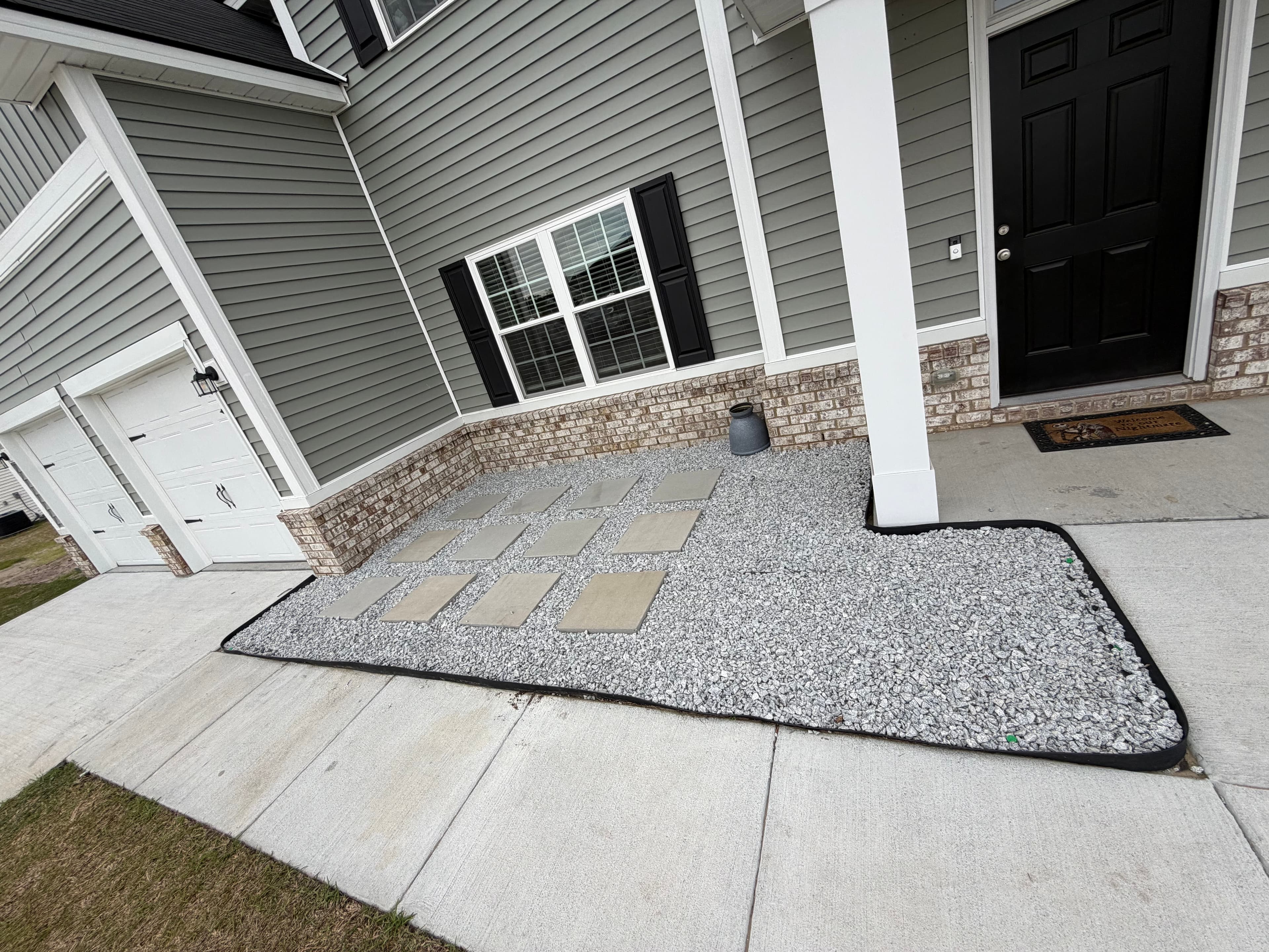 Paver and gravel hardscaping at front entry by A&P Lawn Care in Liberty County, GA